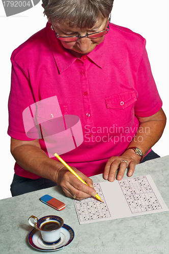 Image of pensioner with sudoku