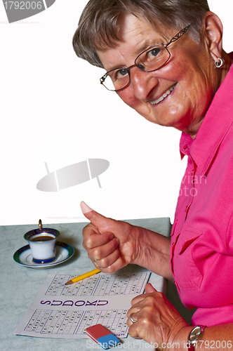 Image of pensioner with sudoku