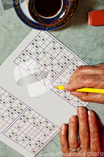 Image of pensioner with sudoku