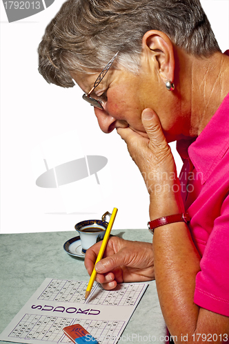 Image of pensioner with sudoku