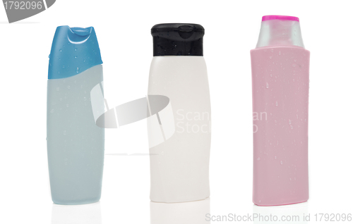 Image of Three blank shampoo bottles