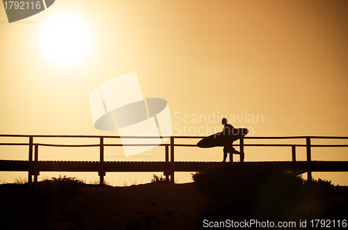 Image of Surfer running to the beach