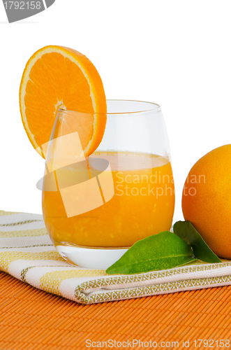 Image of Cup of orange juice and fresh orange