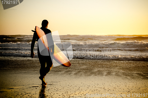 Image of Surfer walking