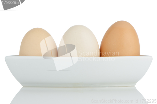 Image of Brown eggs in white ceramic bowl