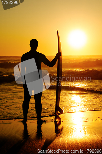 Image of A surfer watching the waves