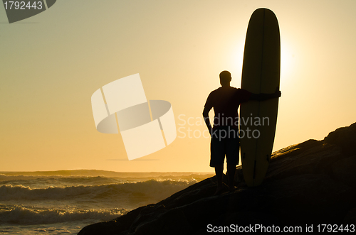 Image of Long boarder watching the waves