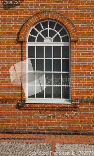 Image of White painted wood arched window