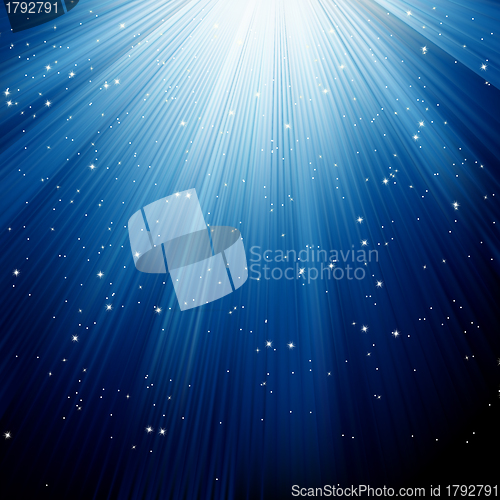 Image of Snowflakes and stars descending blue light. EPS 8
