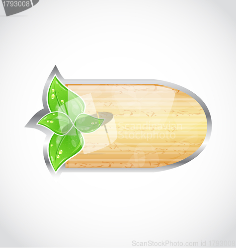 Image of Wooden board with eco green leaves