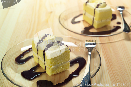 Image of fresh cream cake closeup with chocolate sauce