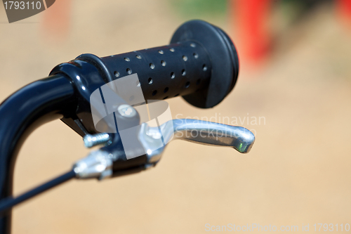 Image of handle of a bike with the brake lever