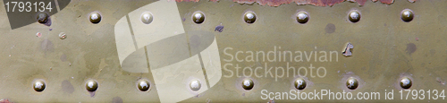 Image of metal surface with rivets