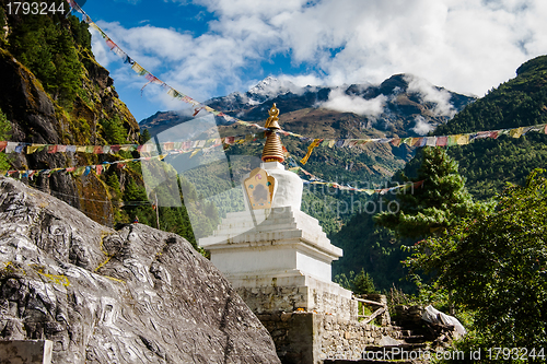 Image of Buddhism: stupe or chorten with prayer flags in Himalayas