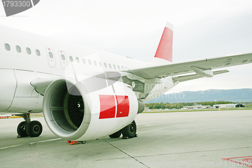 Image of engine of passenger airplane waiting in airport 