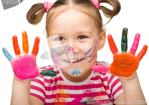 Image of Portrait of a cute girl with painted hands