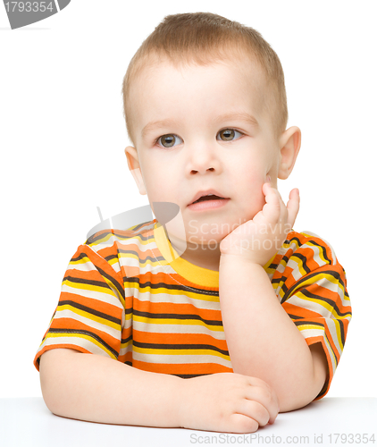 Image of Portrait of a cute little boy looking at something
