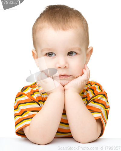 Image of Portrait of a cute little boy looking at something