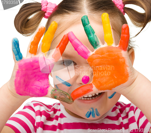 Image of Portrait of a cute girl with painted hands