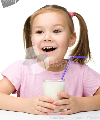 Image of Cute little girl with a glass of milk
