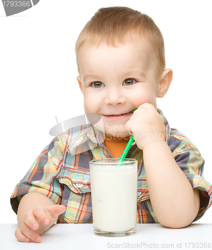 Image of Cute little boy with a glass of milk