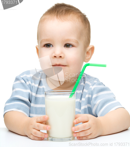 Image of Cute little boy with a glass of milk