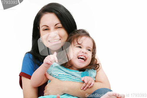 Image of Closeup of happy young mother having fun with her daughter