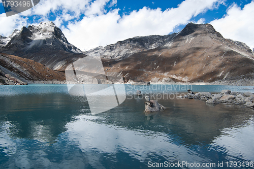 Image of Balance and harmony: Stone stacks and Sacred Lake near Gokyo