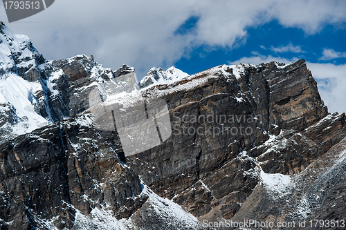 Image of From the top of Gokyo Ri: rocks and snowed cliffs view