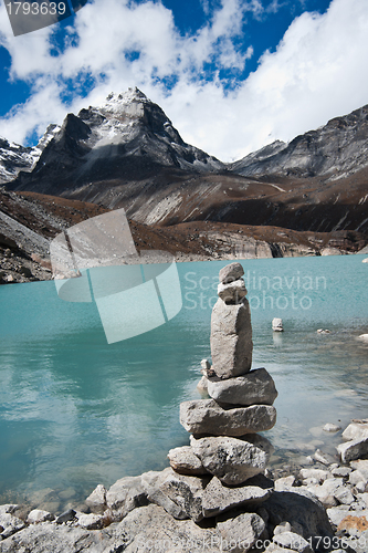 Image of Harmony: Stone stack and Sacred Lake near Gokyo