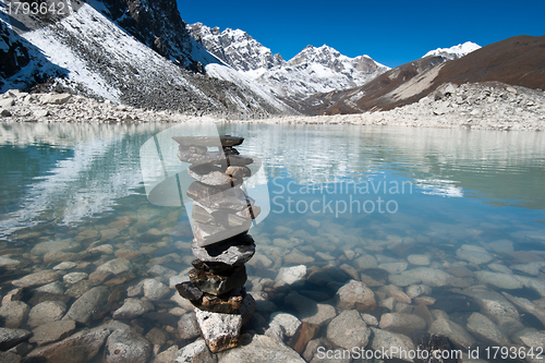 Image of Harmony and balance: Stones and Sacred Lake near Gokyo