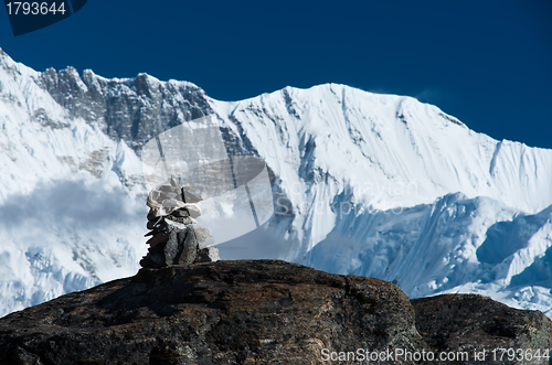 Image of Harmony: Stone stack and mountain range in Himalayas