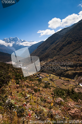 Image of Himalaya landscape: snowed peaks and highland village