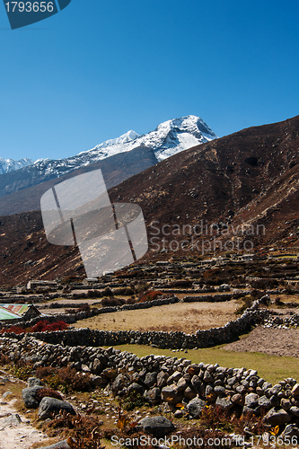 Image of Himalaya landscape: snowed peaks and sherpa village