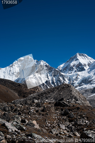 Image of Snowbound mountain peaks and blue sky in Himalayas