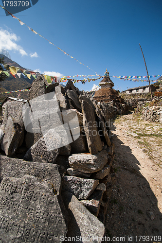 Image of Mani stones and Buddhist stupe or chorten in Himalayas