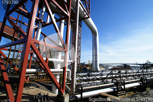 Image of different size and shaped pipes and valves at a power plant