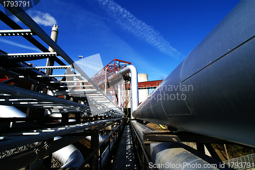 Image of different size and shaped pipes and valves at a power plant