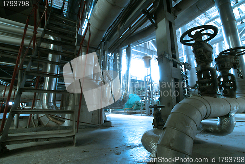 Image of Equipment, cables and piping as found inside of  industrial powe