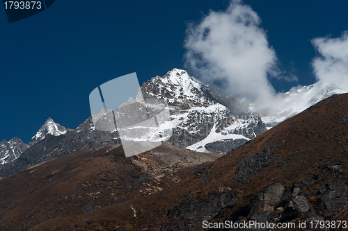 Image of Mountain summit and clouds in Himalayas