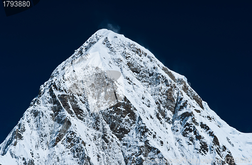 Image of Pumori peak and blue sky in Himalayas, Nepal
