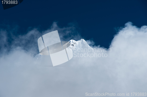 Image of Mountain peak hidden in clouds in Himalayas