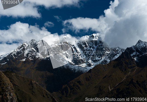 Image of Snowbound mountain peaks and clouds in Himalayas
