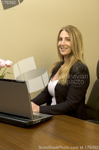 Image of pretty woman at desk