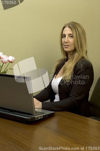 Image of pretty woman at desk