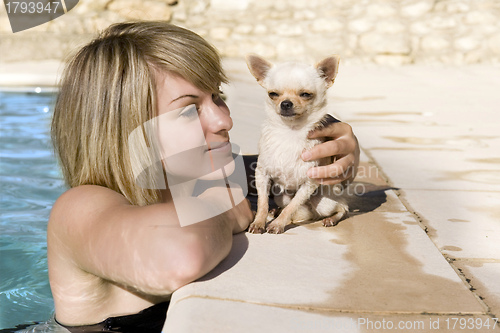 Image of chihuahua and girl in the swimming pool