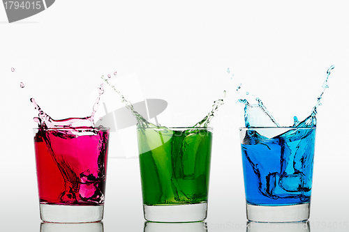 Image of Red Green Blue splashing ice cubes