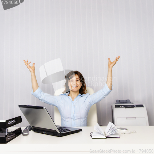 Image of Happy woman in the office