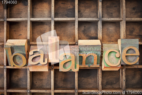 Image of balance word in wood type