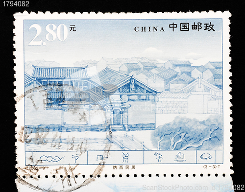 Image of CHINA - CIRCA 2002: A Stamp printed in China shows the famous Naxi dwellings in Lijiang Yunnan, circa 2002